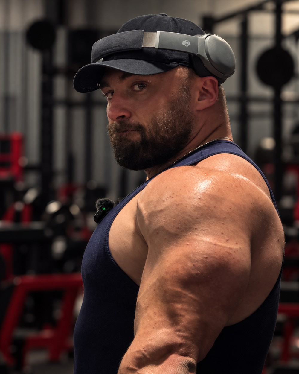 Colton Varcoe in a cap and headphones at the gym